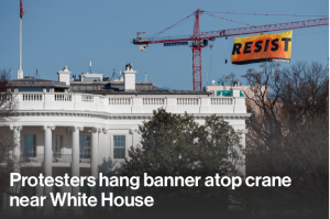 Protesters hang banner atop crane near White House…