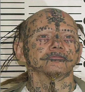 Child molester with face tattoos at large…