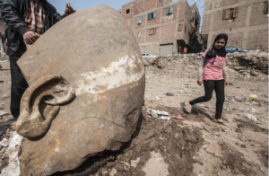 Massive Statue of Ancient Egyptian Pharaoh Found in City Slum…