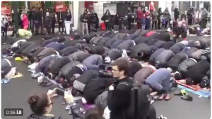 FRANCE IS DEAD: Muslims (somewhere in France) block traffic to say their mid-day prayers. Listen to some irate car drivers honking…