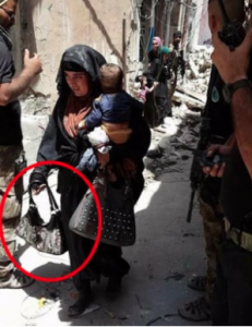 ISLAM: Chilling picture shows female Isis fighter holding child moments before detonating suicide vest…