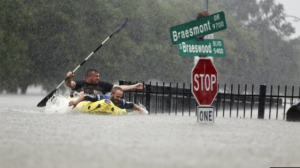 ‘Please send help!’ Thousands are trapped on their roofs in flooded Houston as cops ask ANYONE with a boat to help…