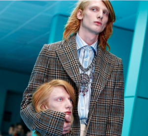 A REPROBATE CULTURE: Models carry their own severed heads down the runway…