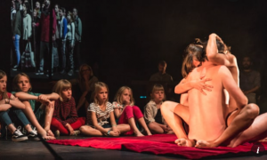‘Lam Gods’ – a play by Milo Rau in Belgium: Contains a couple – as Adam and Eve who simulate sex in front of a semi-circle of children…