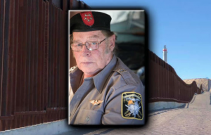 FBI arrests member of militia, Larry Mitchell Hopkins, 69, accused of detaining migrants.