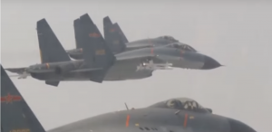 Chinese fighter jets cross Taiwan Strait median line amid US official visit.