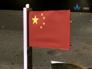 China releases image of its flag on the moon as spacecraft carrying lunar rocks lifts off.